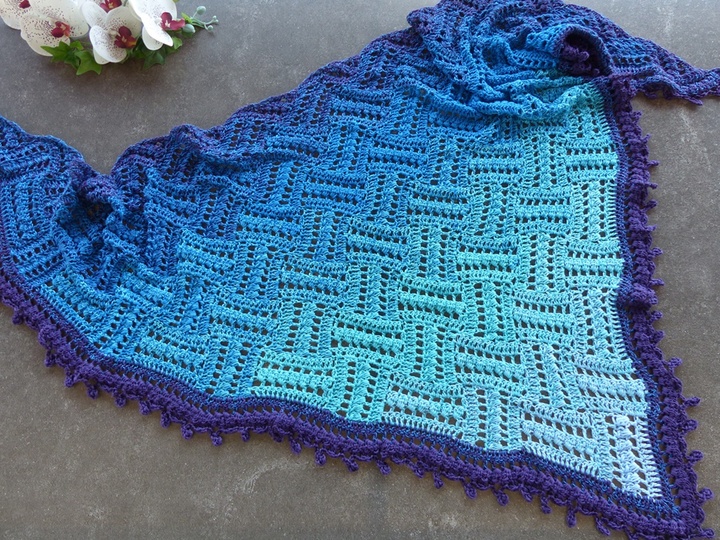 Step by step crochet instructions for a shawl with a sophisticated pattern