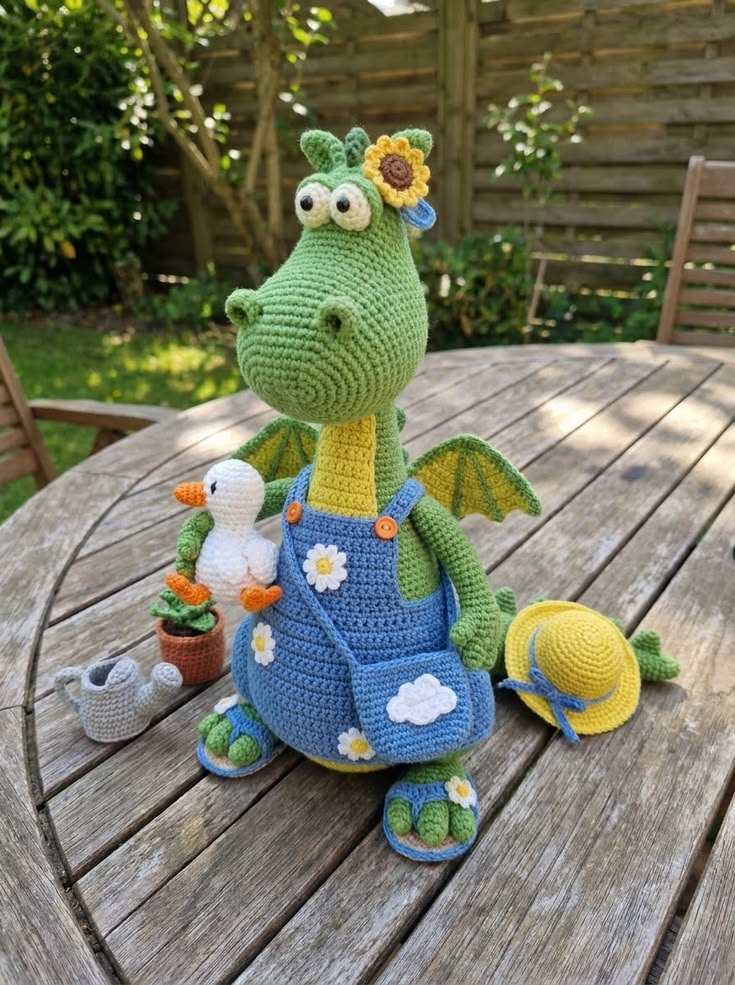 Garden Dragon in Blue Daisy Overalls with Duckling and Sun Hat Free Crochet Pattern