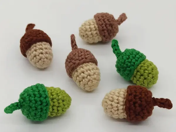 Small crocheted acorns